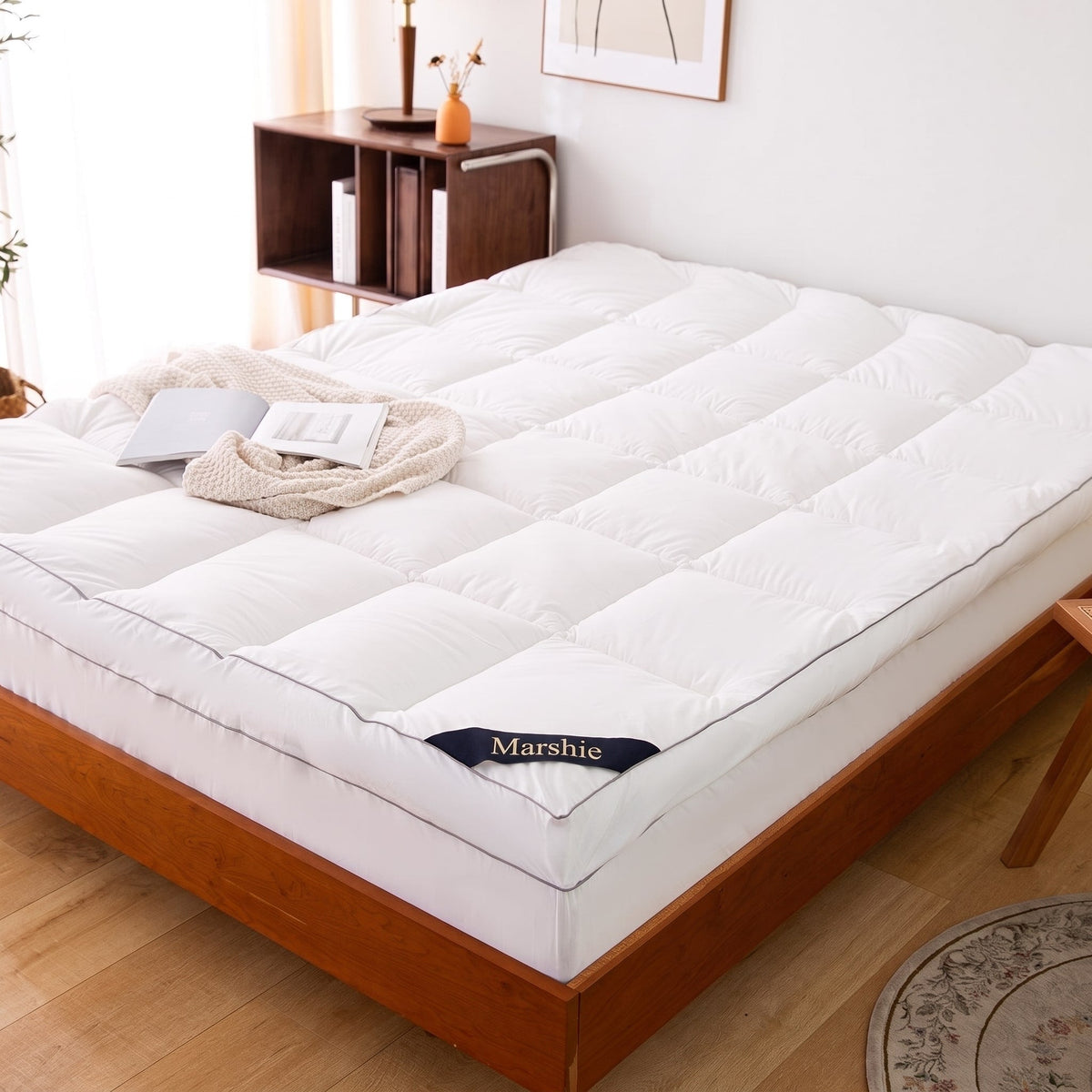 The Marshie Topper fitted on a queen bed in a bright bedroom
