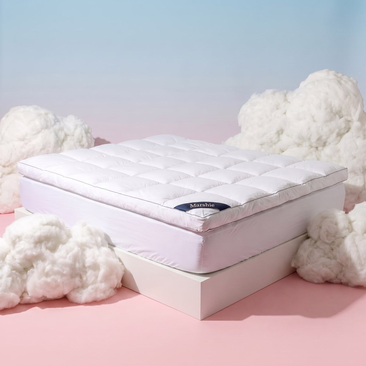 The Marshie Topper on a bed in a bright bedroom
